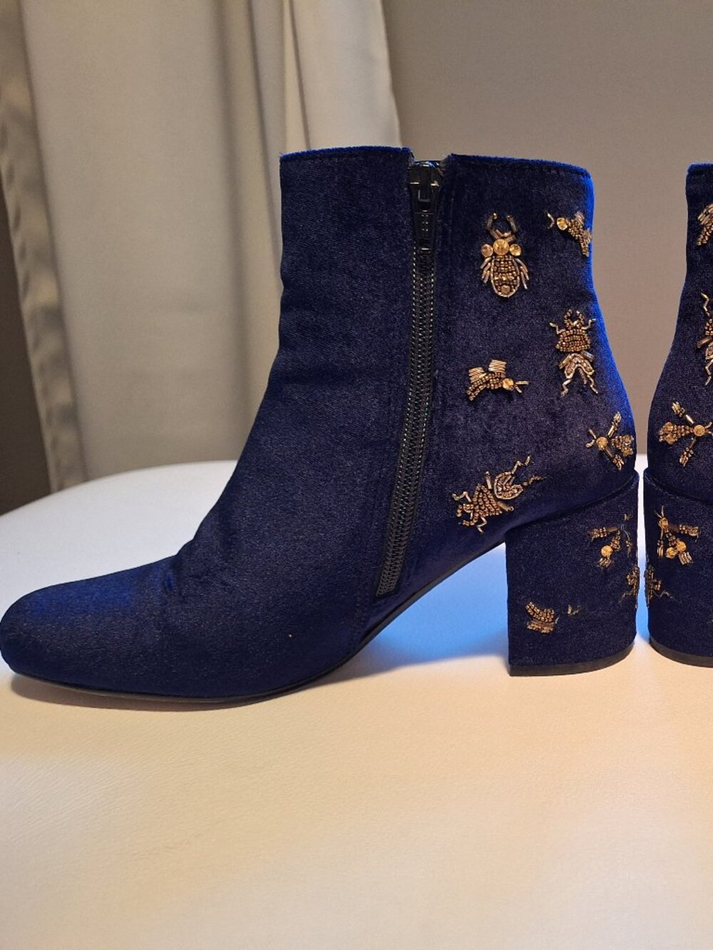 Barneys New York navy blue velour ankle boots with metal "bugs" detailing
